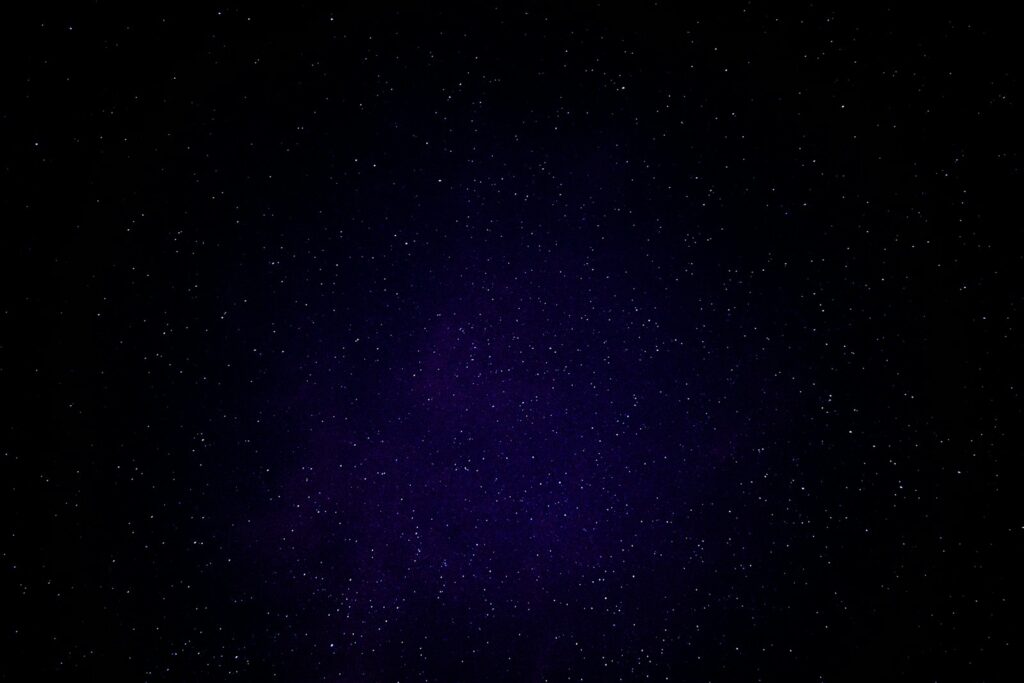 blue sky with stars at nighttime